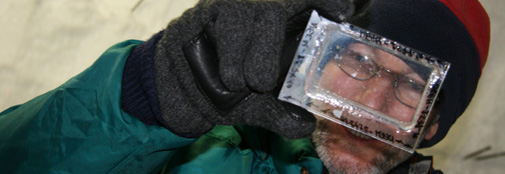 Sepp studying a section of ice for air bubbles and clatherates.