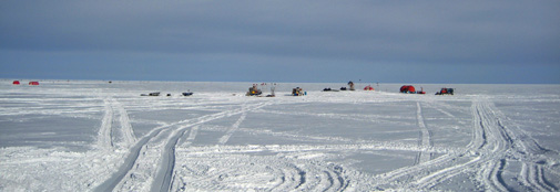 A view from the West of the old camp (right) and the two new weatherports in the new camp area (left).