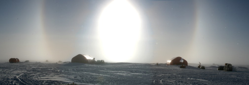 When the air is full of ice crystals, a halo may form around the Sun.