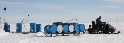 Empty drums are moved from the drillers roof